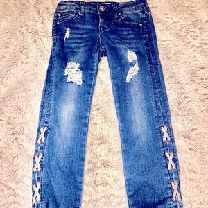 Girls Hudson distressed jeans with cris cross detail.